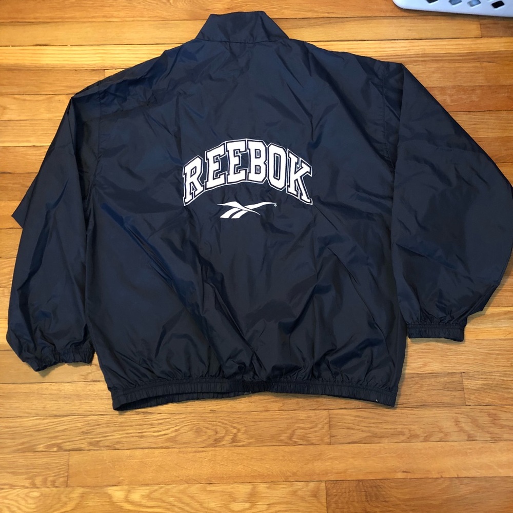 VINTAGE REEBOK SPELL OUT WINDBREAKER